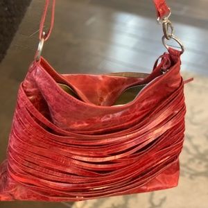 Strappy red leather purse